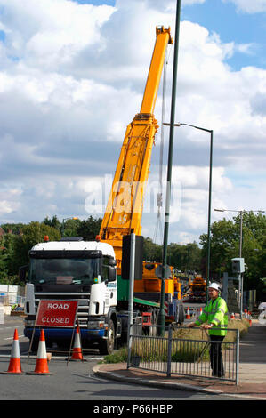 Mobile crane blocking access to road, Manchester, UK. Stock Photo