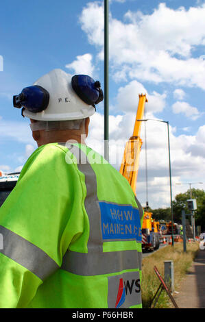 Mobile crane blocking access to road, Manchester, UK. Stock Photo