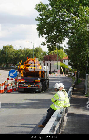 Mobile crane blocking access to road, Manchester, UK. Stock Photo