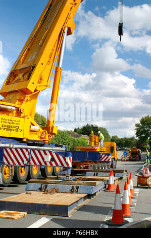 Mobile crane blocking access to road, Manchester, UK. Stock Photo