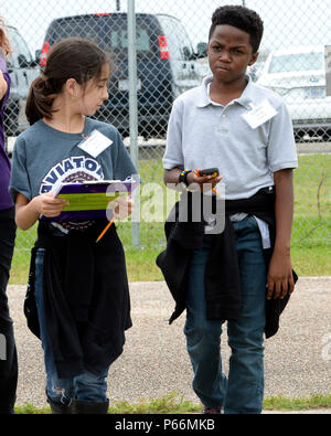 On April 29, 2016, fifth graders from Fred Roberts Middle School visited Starbase Houston at Ellington Field to learn about GPS navigation and waypoint identification. The Department of Defense Starbase program offers educational activities in STEM subjects, supported by the U.S. Air National Guard. Students participated in hands-on exercises to understand map reading, coordinates, and navigation techniques, fostering interest in science, technology, engineering, and mathematics through experiential learning opportunities in Texas. Stock Photo