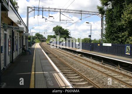 General platform view of Berkswell station, Warwickshire showing pedestrian exit and overhead electric catenary. 2007 Stock Photo