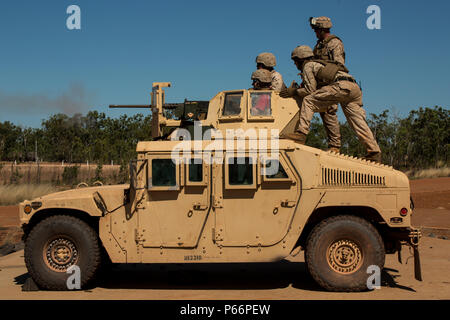 Ray Mabus, Secretary of the Navy, fires a M2 .50-caliber Browning machine gun from a Humvee at Mount Bundey Training Area, Northern Territory, Australia, May 14, 2016. Mabus came to Australia to visit the Marines and Sailors of Marine Rotational Force – Darwin and observe live-fire ranges. (U.S. Marine Corps photo by Cpl. Mandaline Hatch/Released) Stock Photo