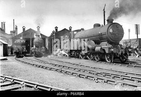 Newhaven shed on 12th July 1947. IN pride of place is No.2037 Selsey Bill, one of the classic Marsh LBSCR, H1 Class 4-4-2 Atlantics. This shed had sev Stock Photo