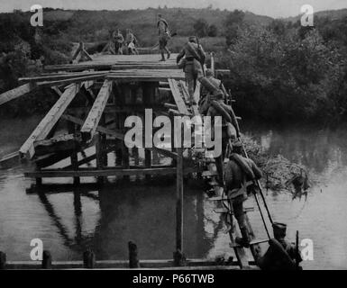 Serbian soldiers cross a temporary bridge at the river koloubara, 1916 during world war one Stock Photo