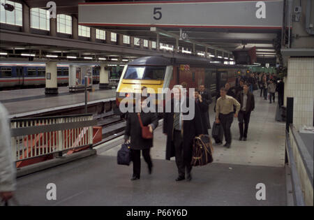 Passengers leaving a train newly arrived from the north at Euston station, London. C 1999 Stock Photo