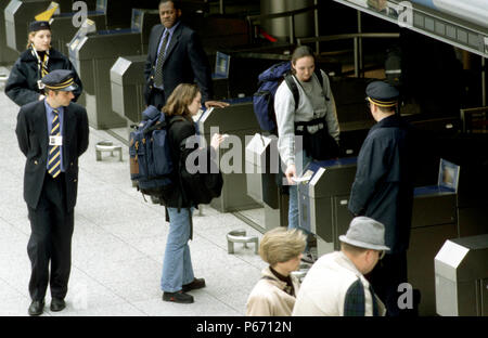 Travellers at the check-in barriers at Waterloo International station, London about to travel on a Eurostar service to Paris or Brussels. C1999. Stock Photo