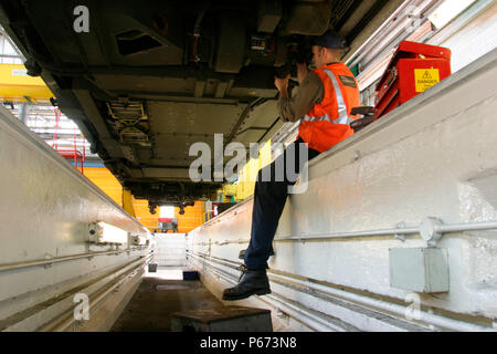 An engineer carries out checks on refurbished London Underground stock at Bombardier's works at Ruislip. May 2004. Stock Photo