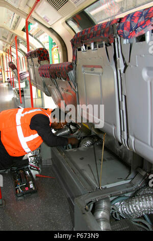 An engineer carries out checks on refurbished London Underground stock at Bombardier's works at Ruislip. May 2004. Stock Photo