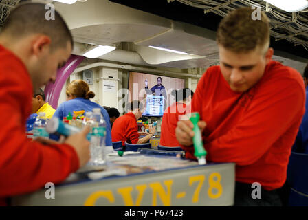 NEWPORT NEWS, Va. (May 4, 2016) – Pre-Commissioning Gerald R. Ford (CVN 78) Sailors attend the ship's first bingo night hosted by MWR in the ship's conglomerate galley. Bingo was one of the command recreational activities offered during Ford’s first fast cruise. (U.S. Navy photo by Mass Communication Specialist Seaman Cathrine Mae O. Campbell/Released) Stock Photo