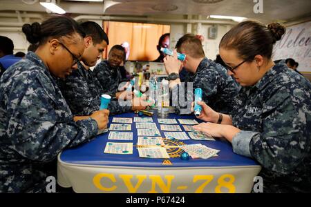 NEWPORT NEWS, Va. (May 4, 2016) – Pre-Commissioning Gerald R. Ford (CVN 78) Sailors attend the ship's first bingo night hosted by MWR in the ship's conglomerate galley. Bingo was one of the command recreational activities offered during Ford’s first fast cruise. (U.S. Navy photo by Mass Communication Specialist Seaman Cathrine Mae O. Campbell/Released) Stock Photo