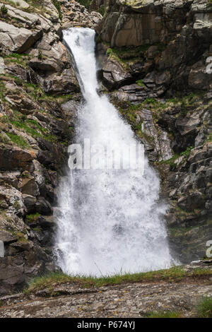 La Cua de Cavalt, Horses Tail, waterfall on the Rio de Nuria river in the Vall de Nuria flowing strongly full of water in the Pyreneean mountains, Cat Stock Photo