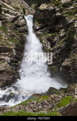 La Cua de Cavalt, Horses Tail, waterfall on the Rio de Nuria river in the Vall de Nuria flowing strongly full of water in the Pyreneean mountains, Cat Stock Photo