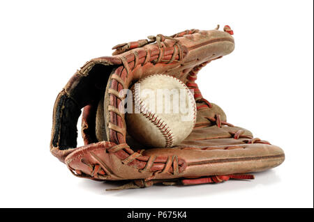 old vintage baseball glove with the baseball held in the palm isolated over white background Stock Photo