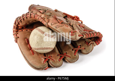old vintage baseball glove with the baseball held in the palm isolated over white background Stock Photo