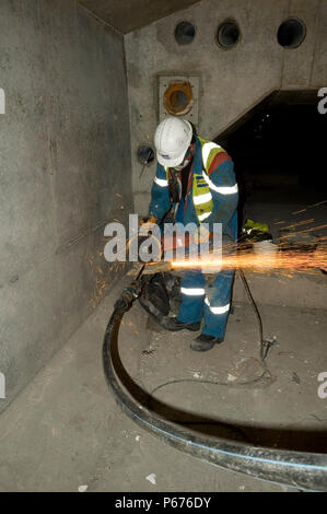 Engineers working on the stress cables that help to strengthen the bridge Stock Photo