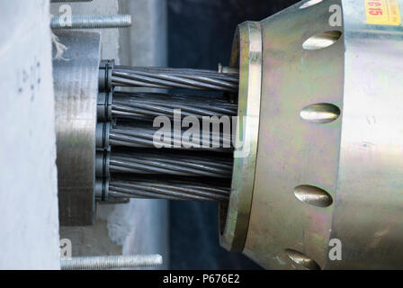 Engineers working on the stress cables that help to strengthen the bridge Stock Photo