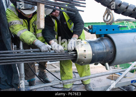 Engineers working on the stress cables that help to strengthen the bridge Stock Photo