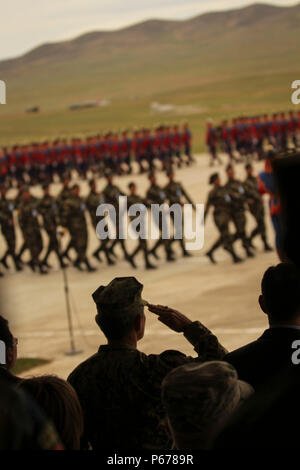 A multinational formation of troops conduct a pass in review during the opening ceremony for Khaan Quest 2016, at Five Hills Training Area, Mongolia, May 22, 2016. Khaan Quest is an annual, multinational peacekeeping operations exercise conducted in Mongolia and is the capstone exercise for this year's United Nations Global Peace Operations Initiative program. (U.S. Marine Corps photo by Cpl. Hilda M. Becerra / Released) Stock Photo