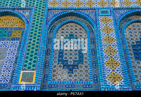 Colorful Islamic patterns, window covered with Arabic screen, mosaic tiles. Dome of the Rock, Temple Mount mosque, Jerusalem, Israel Stock Photo