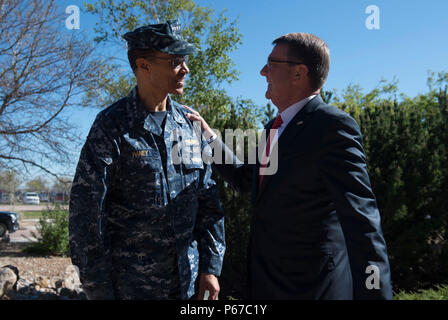 Secretary of Defense Ash Carter is greeted by Adm. Cecil Haney, Commander of U.S. Strategic Command (USSTRATCOM) as he arrives to visit the Joint Interagency Combined Space Operations Center at Shriever Air Force Base, Colo., May 12, 2016 . (Photo by Senior Master Sgt. Adrian Cadiz)(Released) Stock Photo