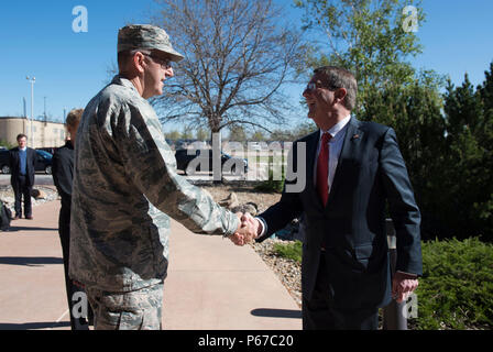Secretary of Defense Ash Carter is greeted by Gen. John E. Hyten Commander, Air Force Space Command, as he arrives to visit the Joint Interagency Combined Space Operations Center at Shriever Air Force Base, Colo., May 12, 2016 . (Photo by Senior Master Sgt. Adrian Cadiz)(Released) Stock Photo