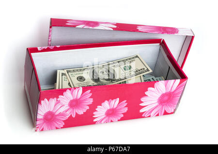 In the box stacked in the form of a bundle of bills of one hundred US dollars. Stock Photo