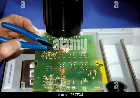 Assembling printed circuit boards. c1993 Stock Photo