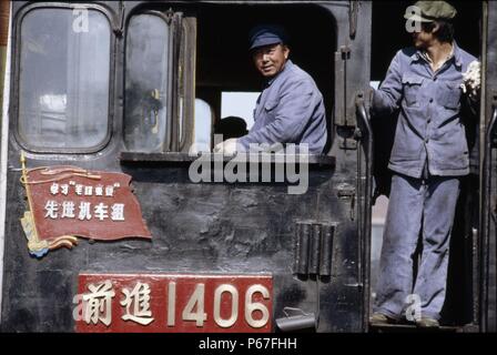 Driver and fireman on a China Railway QJ 2-10-0 at Changchun in Jilin Province. Stock Photo