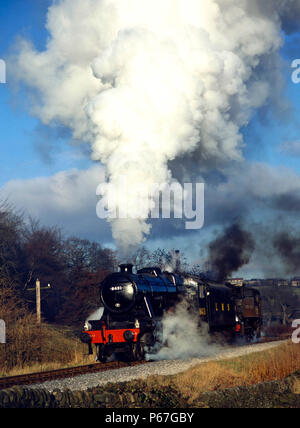 K.&.W.V.R. Santa Special. Nos.8431 and 72 power up the gradient from Howarth  to Oxenhope to pick up the first train of the day. 07.12.1980. Stock Photo