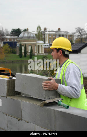 Bricklayer constructing cavity wall. Stock Photo