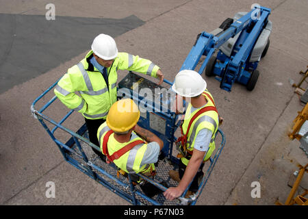 Manager and construction Worker in a cherry picker Stock Photo
