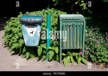 Dog waste bin and rubbish bin in a Welsh park Stock Photo