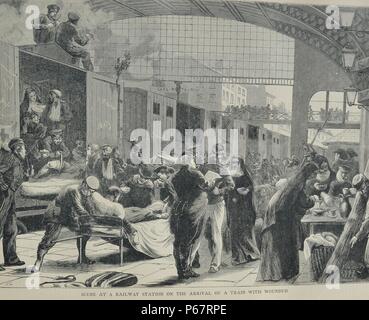 Engraving depicts a scene at a railway station on the arrival of a train with wounded soldiers. Dated 1870 Stock Photo