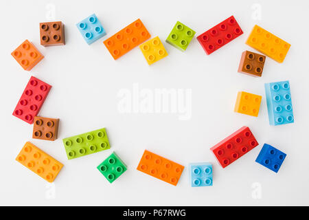 toy bricks of assorted colors on white background Stock Photo