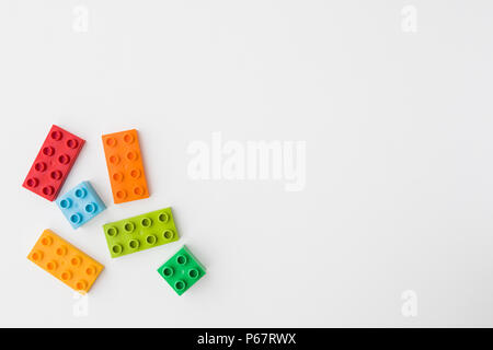 toy bricks of assorted colors on white background Stock Photo