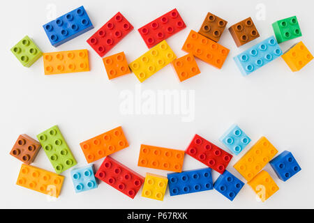 toy bricks of assorted colors on white background Stock Photo