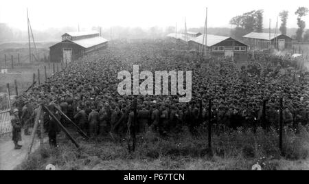 Photograph of German POWs packed into the Nonant le Prin prisoner camp after being captured in the Falaise Pocket. Dated 1944