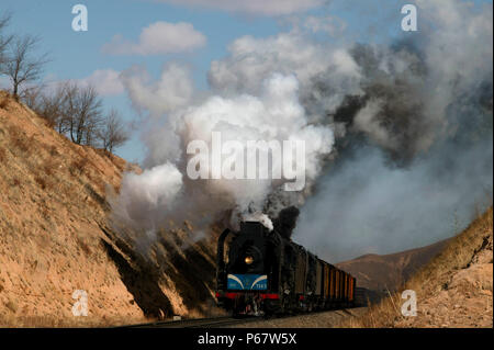 The cutting west of Liudigou Station on the Jing Peng section of the Ji-Tong Railway Inner Mongolia is a superb location for east bound freights climb Stock Photo