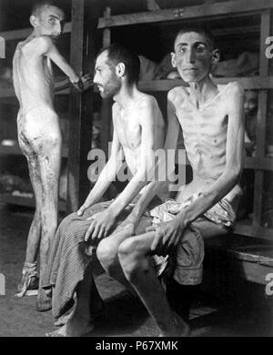 Image shows three prisoners of war at the Buchenwalk concentration camp. They're said to be Russian, Polish, and Dutch. Dated around 1944 during the Second World War. Stock Photo