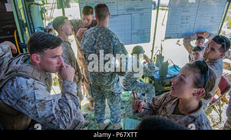 Second Lt. Katherine Boy, right, leads a fire direction center at the Field Artillery Basic Officers Leadership Course at Fort Sill, Oklahoma, May 12, 2016. The fire direction center is responsible for calculating and transmitting fire coordinates to the gun line. Stock Photo