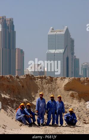 "Construction Workers on site of New Shopping Mall, Dubai, United Arab Emirates." Stock Photo