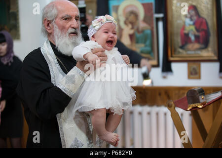 Belarus, Gomel, 25 March. 2018. The Prudhkovsky Church.The rite of baptism. Adoption of the Orthodox Faith Stock Photo