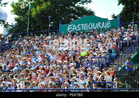 Tennis fans enjoy the hot sunshine during the Nature Valley International tennis tournament at Devonshire Park in Eastbourne East Sussex UK. 25 June 2018 Stock Photo