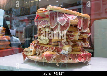 Spain street food, a display of bocadillos - bread filled with Iberico ham - in a snack bar in Cordoba (Cordova), Spain. Stock Photo