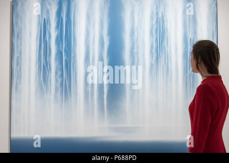 London, UK.  28 June 2018. A visitor views 'Waterfall', 2014, by Hiroshi Senju. Members of the public visit Masterpiece London, the world's leading cross-collecting art fair held in the grounds of the Royal Hospital Chelsea.  The fair brings together 160 international exhibitors presenting works from antiquity to the present day and runs 28 June to 4 July 2018.  Credit: Stephen Chung / Alamy Live News Stock Photo