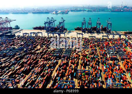Beijing, China. 4th May, 2018. Aerial photo taken on May 4, 2018 shows the Qianwan Container Terminal in Qingdao, east China's Shandong Province.(TO GO WITH Xinhua Headlines:China's WTO entry a benefit to the world ) Credit: Guo Xulei/Xinhua/Alamy Live News Stock Photo