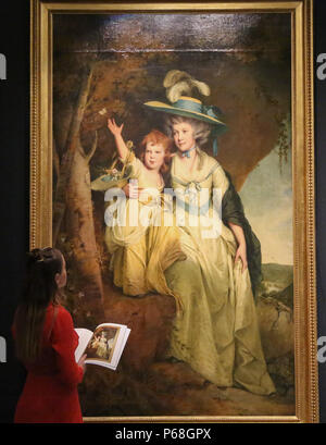 Sotheby's London. UK 29 June 2018 - A woman looks at Joseph Wright of Derby's Portrait of Susannah Arkwright, Mrs Charles Hurt and her daughter Mary Anne oil on canvas (Est £1.5-2 million) Old master & British paintings and drawings, decorative arts, sculptures and antiquities spanning over two Millennia on auction at Sotheby's London.   Credit: Dinendra Haria/Alamy Live News Stock Photo