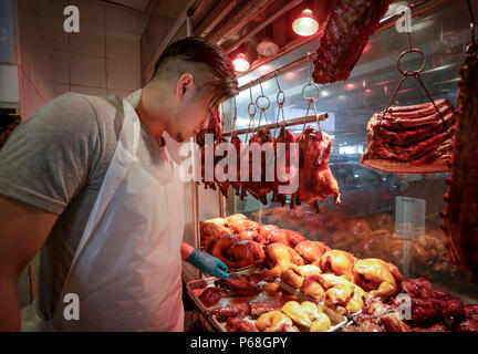 Vancouver, Canada. 28th June, 2018. Anson Leung works at the HK BBQ Master restaurant in the Vancouver suburb of Richmond, Canada, June 28, 2018. TO GO WITH Feature: Young barbecue master carries on Chinese family business in Vancouver Credit: Liang Sen/Xinhua/Alamy Live News Stock Photo