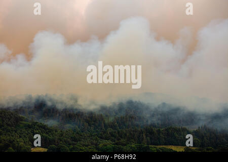 Winter Hill, Greater Manchester, UK. 28th Jun, 2018. Rivington Terraced Gardens, near Bolton in Greater Manchester overcome by smoke from a nearby moorland grassfire. Credit: Jason Smalley Photography/Alamy Live News Stock Photo